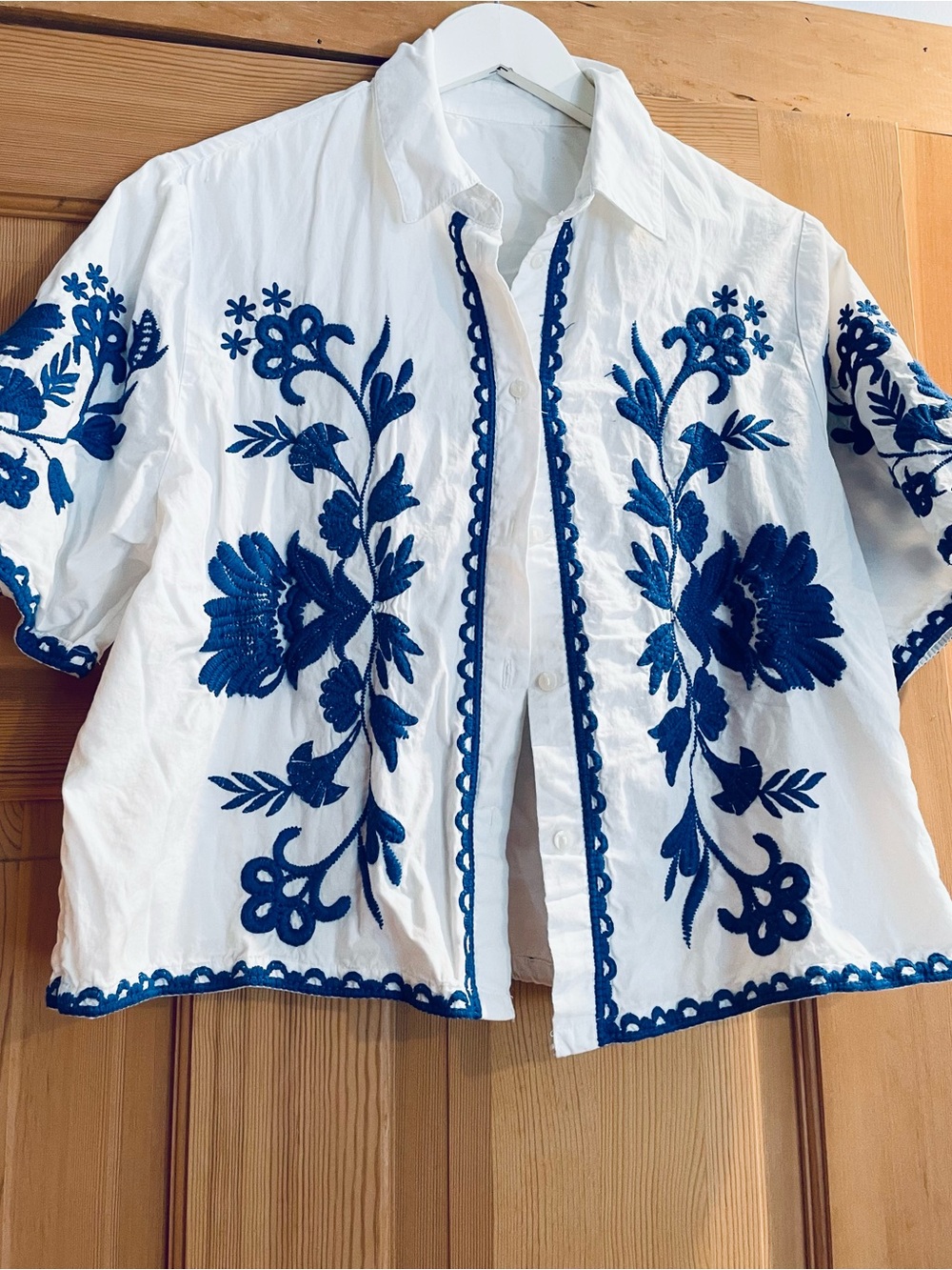 Embroidered White Button-Front Top with Blue Floral Detailing